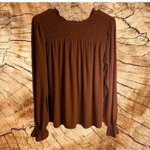 A New Day small long sleeve burnt orange rayon woman's blouse.